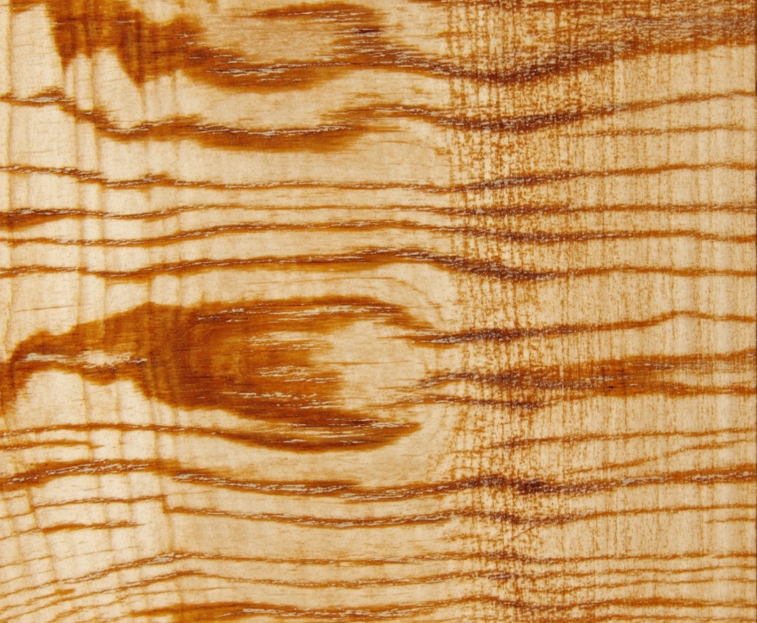 Detailná textúra dubového dreva symbolizujúca kvalitu a pevnosť remesla